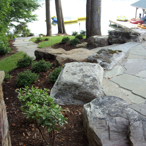Stone patio by Home Tech Construction Services