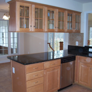 Renovated kitchen by Home Tech Construction Services