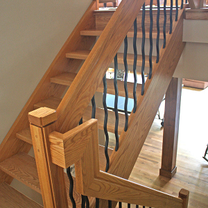 Lake house staircase by Home Tech Construction Services