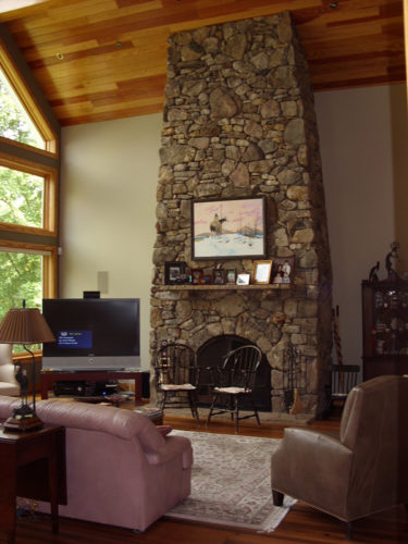 Stone Fireplace With High Ceilings